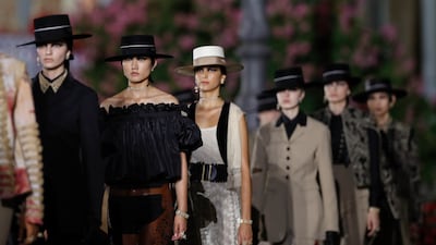 Models walk in the finale of the Dior Cruise 2023 show. AP