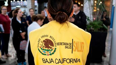 A member of Mexico's Baja California state Health Secretary epidemiology brigade waits at the lobby in preparation for the arrival of China's Hainan Airlines flight HU7925 from Beijing, at the Abelardo L. Rodriguez International airport in Tijuana, Mexico. AFP