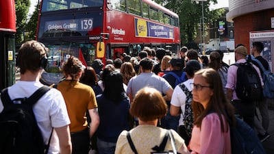 Passengers queue for a bus outside Waterloo station. Reuters