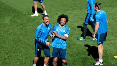 Cristiano Ronaldo of Real Madrid (L) shares a joke with Marcelo of Real Madrid during a training session ahead of the Uefa Champions League semi-final second leg between Real Madrid and Manchester City at Valdebebas training ground on May 3, 2016 in Madrid, Spain. (Photo by Gonzalo Arroyo Moreno/Getty Images)
