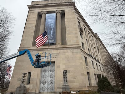 President Donald Trump's image outside the US Department of Justice in Washington on February 19. Thomas Watkins / The National