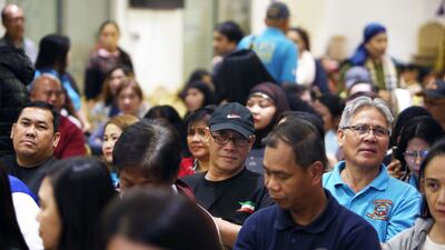 Members of the Filipino community attend a meeting on workers’ protection in Kuwait City in 2018. AFP