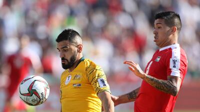 Aziz Behich of Australia battles for possession with Jonathan Zorrilla of Palestine. Getty Images