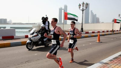 Alistair Brownlee, left, and Jonny Brownlee, right, finished joint first in the short course race at the Abu Dhabi International Triathlon on Saturday. Warren Little / Getty Images/ IMG / March 15, 2014