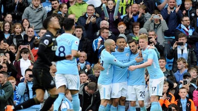 Manchester City players celebrate with Bernardo Silva, second right, after his goal in the 5-0 win over Swansea City. Rui Vieira / AP Photo