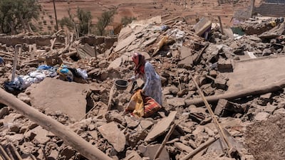 Villagers among the rubble of destroyed buildings near Amizmiz, in El Haouz region. Bloomberg