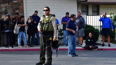 An armed Los Angeles County Sheriff's Department officer secures the premises after a shooting at Saugus High School in Santa Clarita. AFP