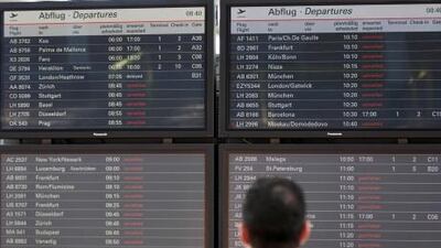 A passengers looks at the information board that shows most of the flights canceled due to elevated levels of ash in the atmosphere stemming from Iceland's Grimsvotn volcano, at the airport in Hamburg, northern Germany, today. AP Photo / Philipp Guelland