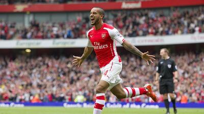 Arsenal's English midfielder Theo Walcott celebrates after scoring their second goal during their English Premier League football match against West Bromwich Albion at the Emirates Stadium in London on May 24, 2015. AFP PHOTO / JUSTIN TALLIS