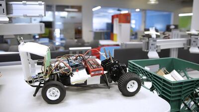 A miniature remote-controlled car sits on a counter at the Ford research laboratory. Eric Risberg / AP Photo