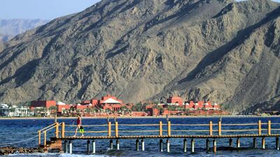 A girl walks on a pier at the Red Sea beach town of Taba, in Egypt's Sinai Peninsula. Israel has closed its Taba border crossing to Egypt on Monday, April 10, 2017. Khalil Hamra / AP Photo