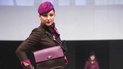 A member of Etihad's cabin crew displays one of the latest uniform designs. Lee Hoagland / The National