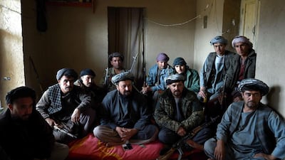 An anti-Taliban armed Afghan commender Farooq (2R) speaks during an interview at his outpost during a patrol against Taliban insurgents at Qara Ghoily in Almar district of northern Faryab province on October 16, 2015. AFP Photo