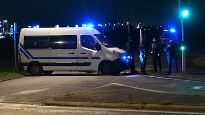 Police block a road near the camp where four people were killed near Dunkirk, France. AFP