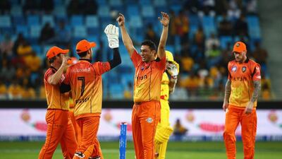 DUBAI, UNITED ARAB EMIRATES - JANUARY 29: Azhar Mahmood of Virgo Super Kings celebrates taking the wicket of Adam Gilchrist of Sagittarius Strikers during the Oxigen Masters Champions League 2016 match between Virgo Super Kings and Sagittarius Strikers at Dubai International Cricket Stadium on January 29, 2016 in Dubai, United Arab Emirates. (Photo by Francois Nel/Getty Images)