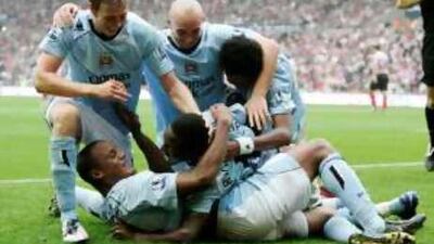 Manchester City players celebrate their second goal at Sunderland on Sunday during their 3-0 win.