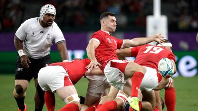Wales' Tomos Williams kicks the ball during the Rugby World Cup Pool D game at Oita Stadium between Wales and Fiji in Oita, Japan. AP Photo