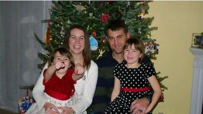 Captain David Thompson at home with his wife Emily, left, and daughters Isabelle and Abigail in North Carolina in 2009. Thompson was killed in January 2010 by Nasir Ahmad Ahmadi, a contract interpreter on his base in Afghanistan. Thompson Family / AP Photo