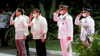 The leaders salute during the inauguration ceremony. AFP