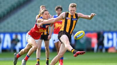 James Sicily of the Hawks is tackled by Eric Hipwood of the Lions on Sunday. Getty Images
