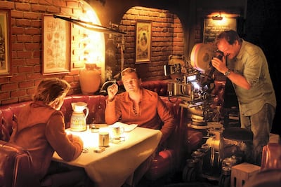 Quentin Tarantino, Leonardo DiCaprio and Brad Pitt on set of the film.