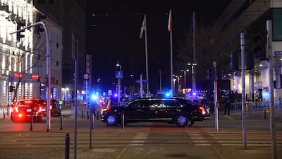Mr Biden in his limousine on the way to a Marriot hotel in Warsaw. EPA