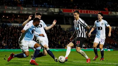 Newcastle United's Joselu, second right, in action with Blackburn Rovers' Darragh Lenihan. Reuters