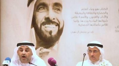 Dr Ali bin Tamim, left, secretary general of the Sheikh Zayed Book Award, and Jumaa Al Qubaisi, the executive director of the National Library, name the winners in Abu Dhabi yesterday. Delores Johnson / The National