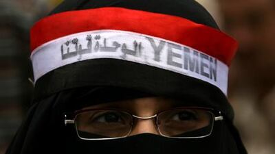 A Yemeni woman takes part in anti-government protests calling for the ouster of Yemeni President Ali Abdullah Saleh in the capital Sanaa on Sunday