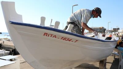 Boat maintenance in Batroun, Lebanon. Reuters