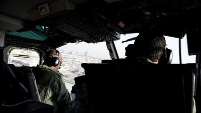 Brig pilot Anas Al Matroushi, left, and Major Ahmed Al Shehhi scan Dubai streets.
