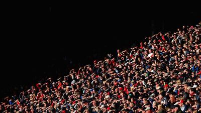 Sunderland supporters shield their eyes from the sun during their club's 3-1 win over Stoke City at the Stadium of Light on Saturday. Alex Livesey / Getty Images