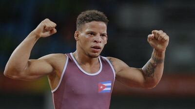 Ismael Borrero Molina of Cuba reacts after defeating Elmurat Tasmuradov of Uzbekiston during the men’s Greco-Roman 59kg semi-final match of the Rio 2016 Olympic Games Wrestling events at the Carioca Arena 2 in the Olympic Park in Rio de Janeiro, Brazil, 14 August 2016. Sergei Ilnitsky / EPA