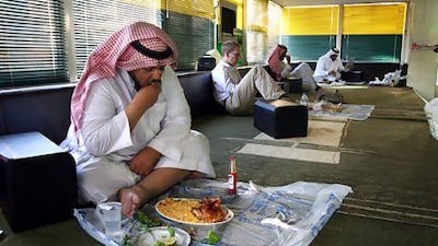 A Saudi man eats his lunch in a restaurant in Riyadh. Food and beverage prices climbed by 6.4 per cent in the kingdom last month. Hasan Sarbakhshian / AP Photo