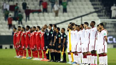 Players and match officials line up before the World Cup qualifying match between Omar and Qatar, in Doha, on June 7, 2021. All photos: Reuters