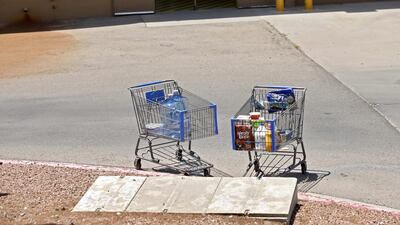 Shopping carts sit next to a curb after a shooting at a Walmart in El Paso, Texas, USA. EPA