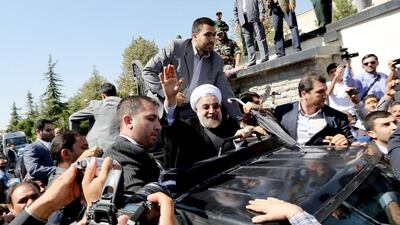 Iranian president Hassan Rouhani arrives at Tehran’s Mehrabad Airport on Saturday. Some 60 hardline Islamists chanted “Death to America” and “Death to Israel” but they were outnumbered by 200 to 300 supporters of the president who shouted: “Thank you Rouhani.” Atta Kenare / AFP