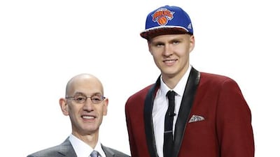 Kristaps Porzingis, right, poses for a photo with NBA Commissioner Adam Silver after being selected fourth overall by the New York Knicks during the NBA basketball draft, Thursday, June 25, 2015, in New York. (AP Photo/Kathy Willens)