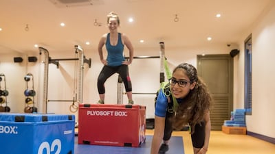 Samiha Hamze, front, and Kristin Mcgrath at The Club’s Studio Two gym for teenagers in Abu Dhabi. Vidhyaa for The National