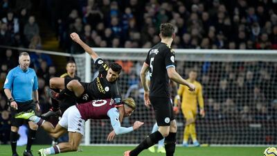 Manchester City's Rodrigo, top, fights for the ball with Aston Villa's Jack Grealish on Sunday. AP