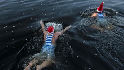 Winter swimmers take part in the traditional Christmas swimming event in the Vltava river in Prague. AFP