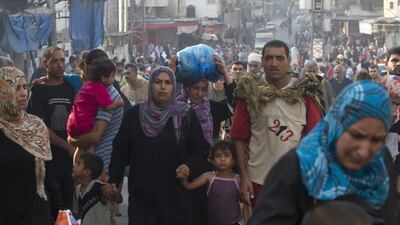 Thousands of Palestinians flee the Shujayeh neighbourhood during heavy Israeli shelling in Gaza City. Israel had said that it had expanded its ground offensive in Gaza. Gaza residents said land and naval shellings were the heaviest in 13 days of fighting up to that point.