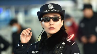 A police officer wearing a pair of smartglasses with a facial recognition system at Zhengzhou East Railway Station in Zhengzhou in China's central Henan province. AFP