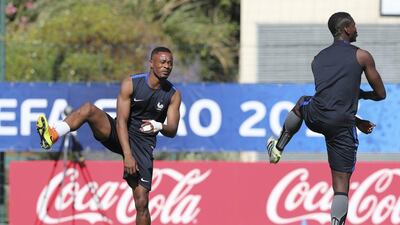 France’s Patrice Evra, left, and Paul Pogba exercise during a training session at the Centre Robert Louis Dreyfus, in Marseille, southern France, Wednesday, July 6, 2016. France will face Germany in a Euro 2016 semi-final match in Marseille on Thursday, July 7, 2016. Claude Paris / AP Photo