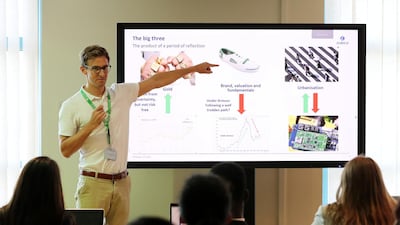 John Astrup, investment product manager at Zurich Middle East, leads an Investars session at Gems Wellington International School in Dubai. Pawan Singh / The National