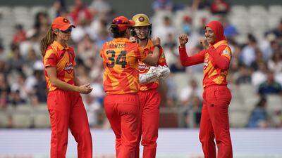 Birmingham Phoenix's Abtaha Maqsood celebrates with team-mates after taking the wicket of Manchester Originals' Eleanor Threlkeld.