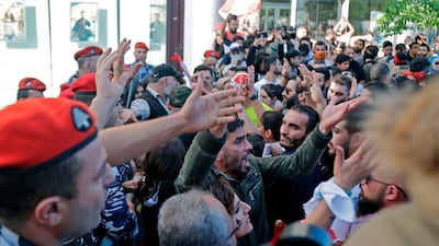 Lebanese protesters trying to reach the parliament in Beirut scuffle with security forces. AFP