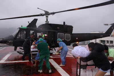 A patient is evacuated on a military helicopter from a hospital in Hat Yai district on Wednesday. Reuters