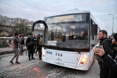 Buses transporting Syrian Democratic Forces members prepare to depart from Sheikh Maqsoud neighbourhood towards areas of north-eastern Syria, in Aleppo. EPA
