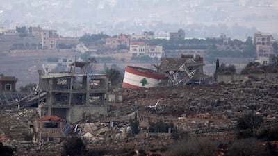 The flag of Lebanon is painted on a destroyed structure in the village of Weiss El Jabal. Getty